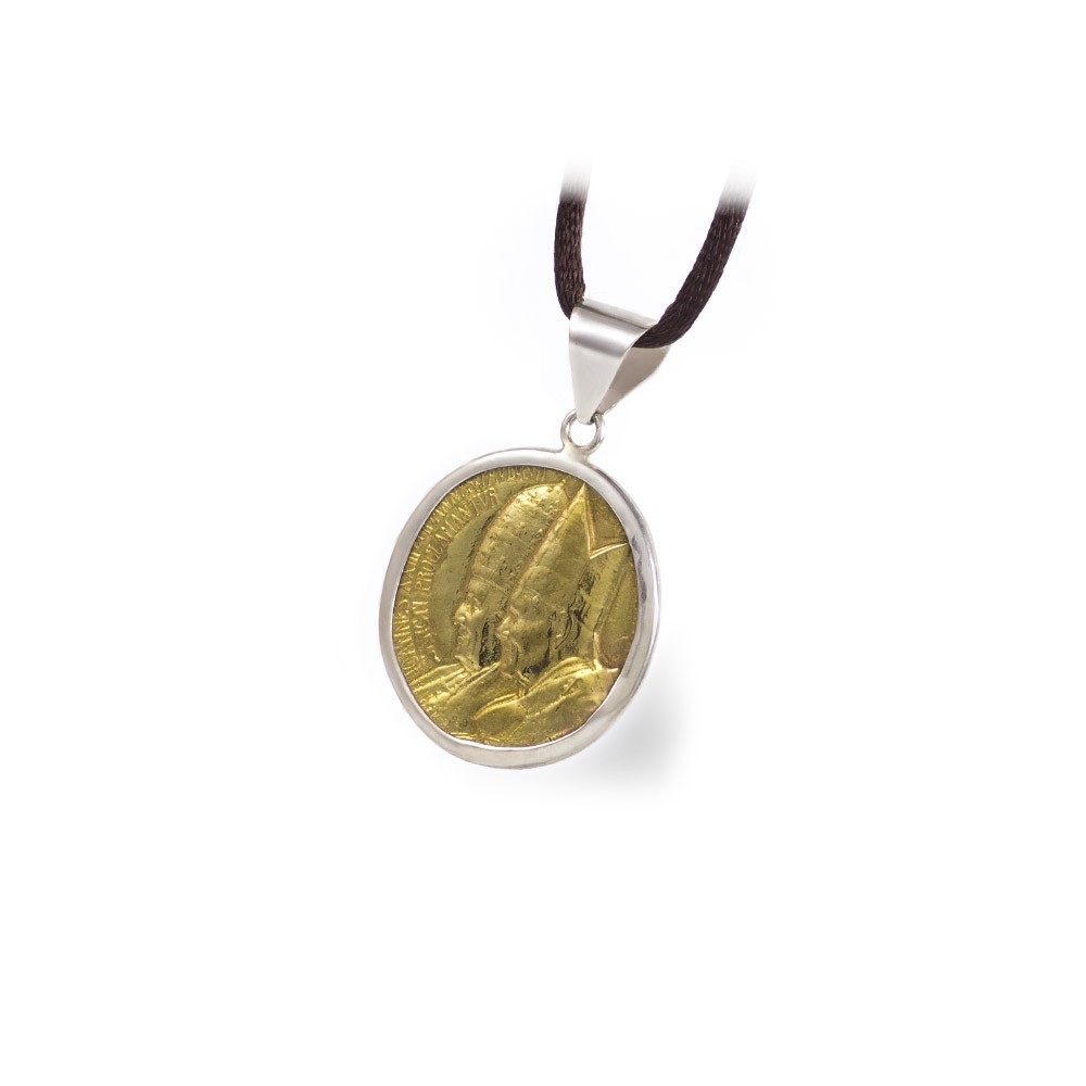 Moneda replica

Colgante con moneda bronce y Plata 1ªLey.